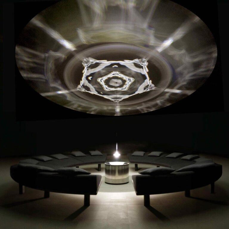 Choreographing perception: Lachlan Turczan’s Wavespace installation Vibrant abstract light projection in a modern art gallery space.