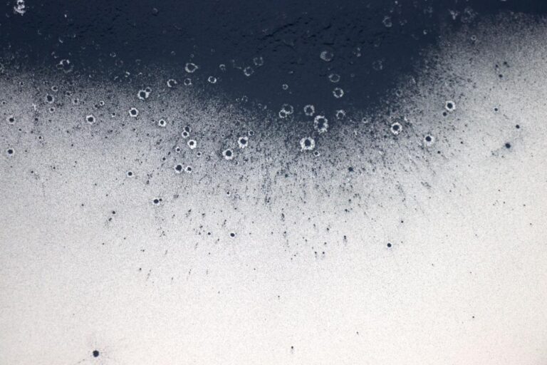 Xingyu Huang visualizes anxiety somatization through sensory art Vibrant blue and black abstract watercolor paint splashes on textured paper.