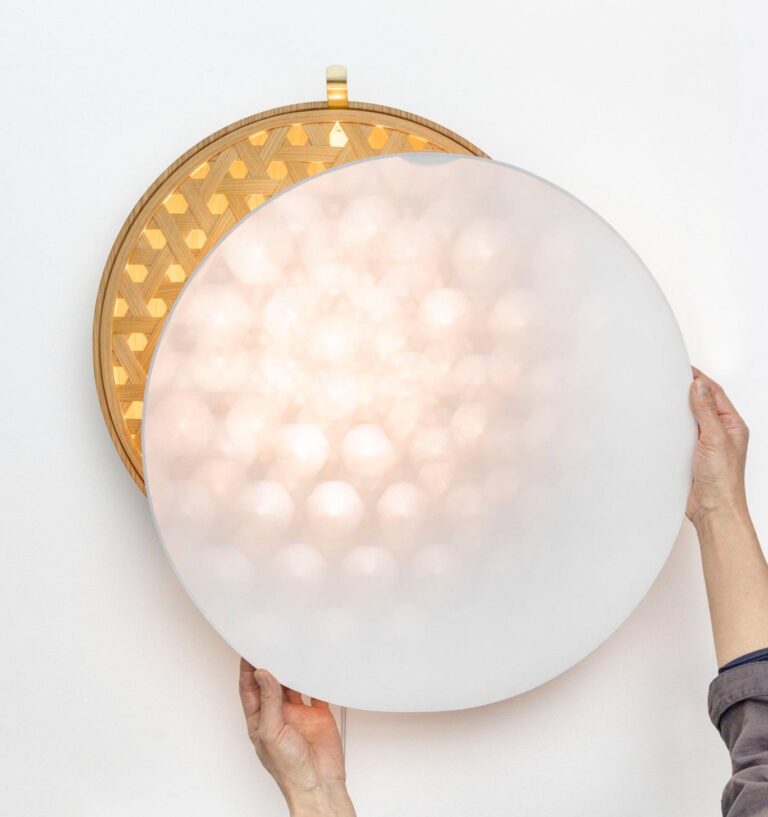 Akiko Ken Made craft sustainable, timeless wooden creations Contemporary wall lamp with wooden and frosted glass design for modern interior decor.
