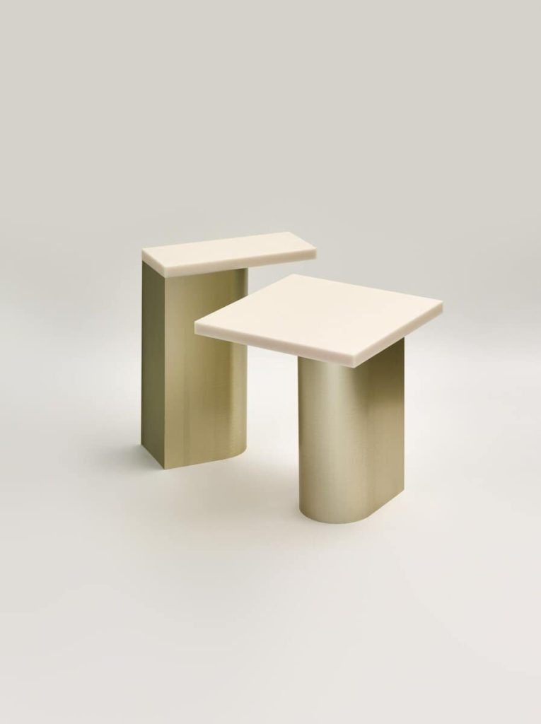Minimalist modern side tables with geometric shapes in neutral tones for contemporary home decor.