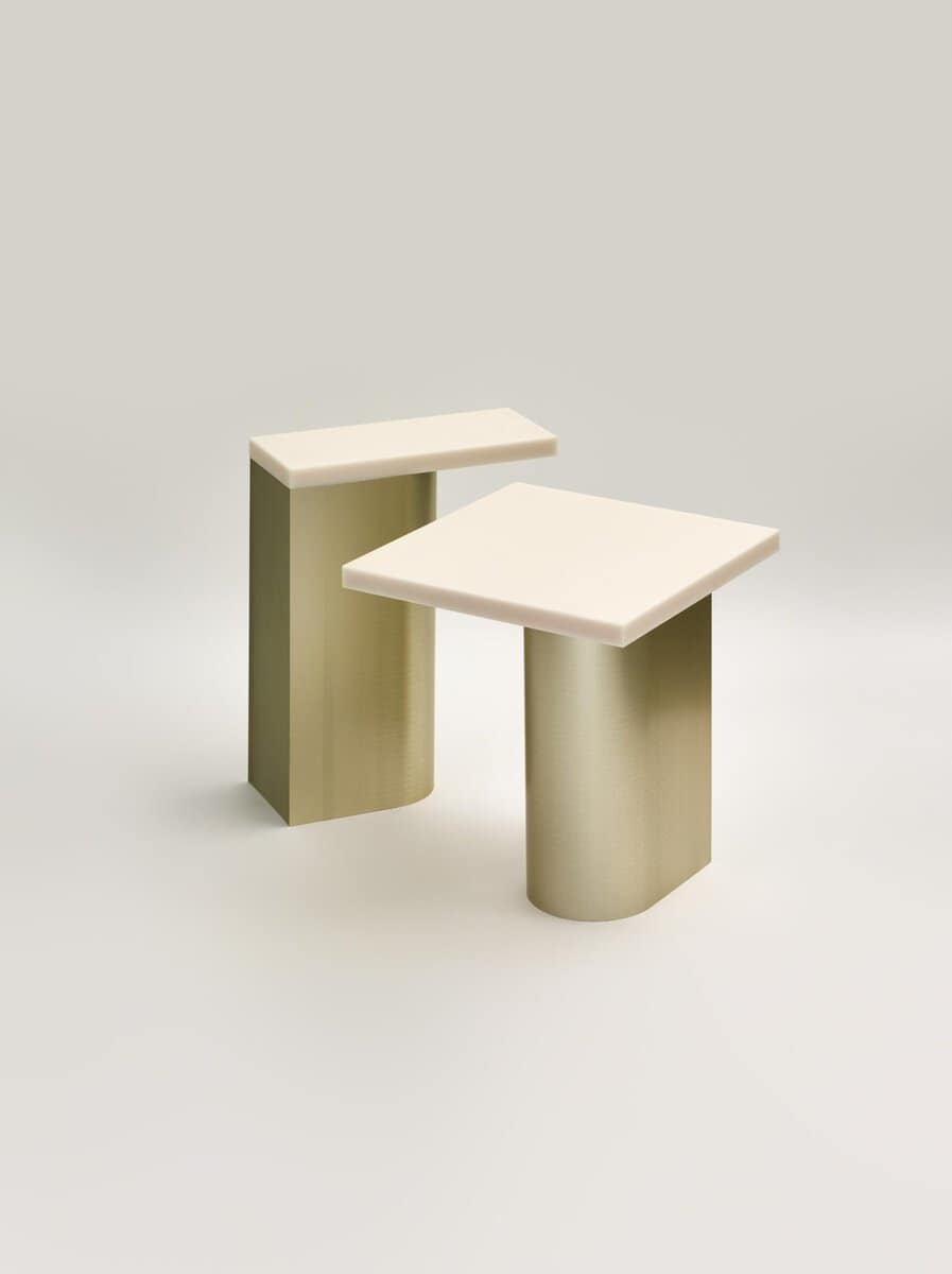Minimalist modern side tables with geometric shapes in neutral tones for contemporary home decor.