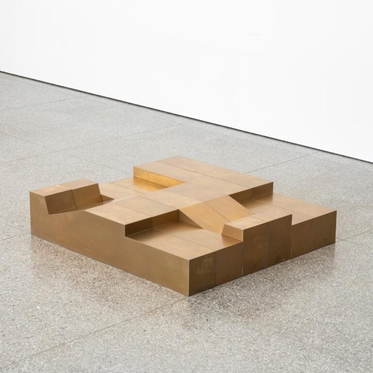 Singchan Design collection relates to the architecture of China's borders Rustic wooden block sculpture displayed in modern gallery space for contemporary art.