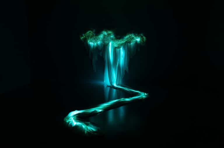 Chisato Matsumoto’s Enchanting Textile Cosmos at Pearl Lam Galleries Illuminated fabric art installation with glowing turquoise light, showcasing innovative textile and light art.