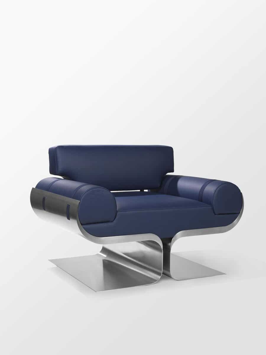 Sleek modern blue leather armchair with metallic base and contemporary design.