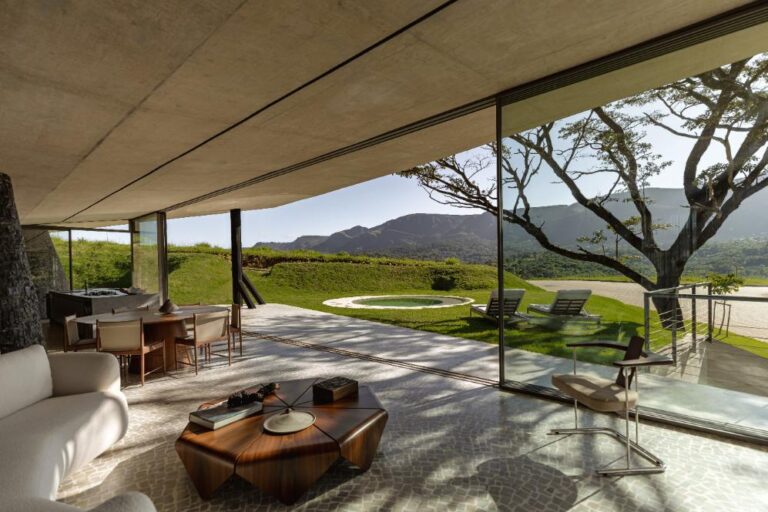One area opens to light-filled spaces with sweeping views of the mountains