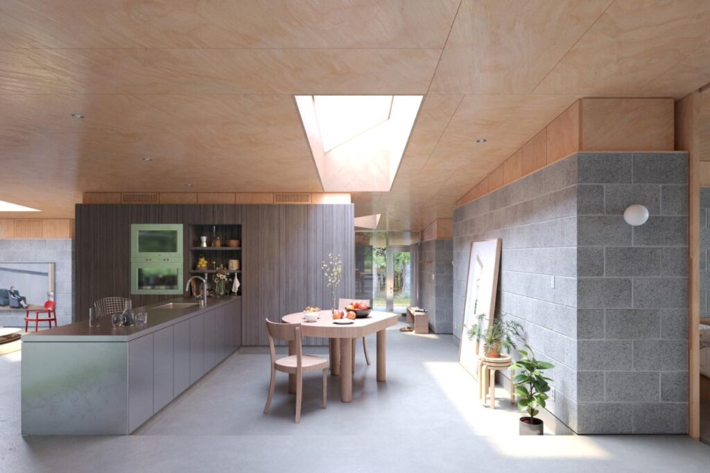 Open-concept living space with T-shaped volumes and floor-to-ceiling windows framing the forest