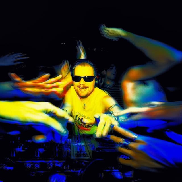Myd: Song For You DJ with vibrant colorful light effects during a music event or party, wearing sunglasses and headphones.