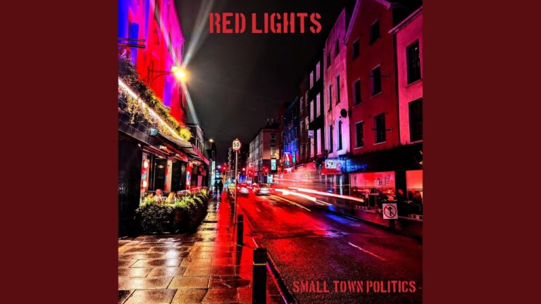 Small Town Politics: Red Lights Red city street at night illuminated with colorful neon lights and streaks of car lights, vibrant urban nightlife scene.