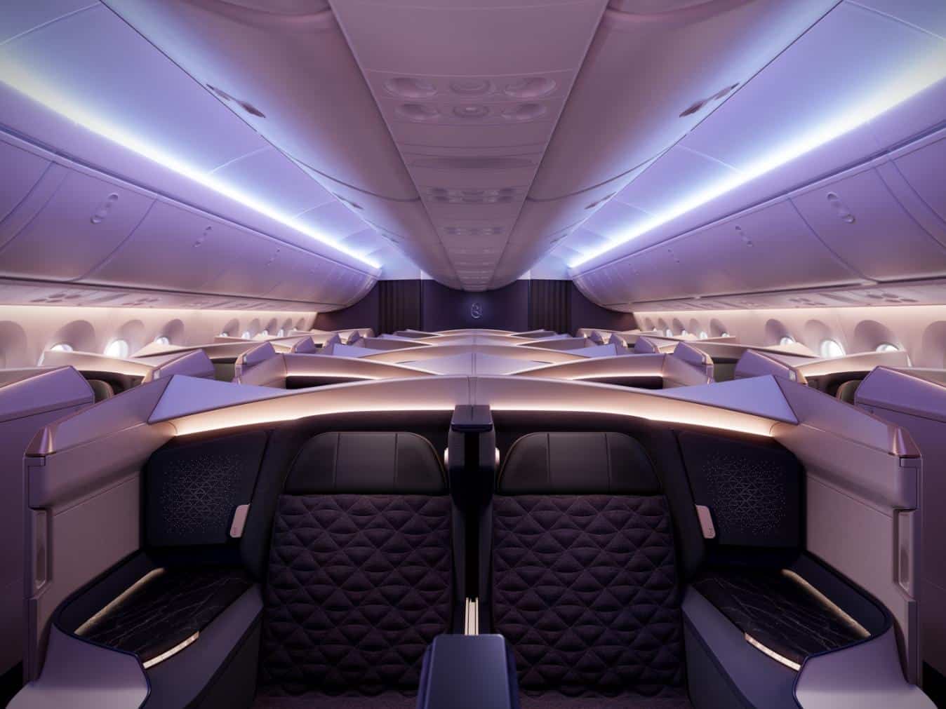 Luxurious airplane cabin with modern seating and ambient LED lighting, designed for comfort.