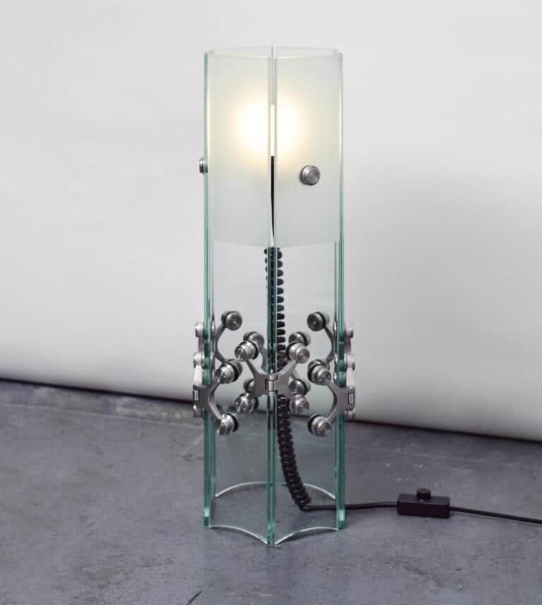 Ferric Glass by Tino Seubert a sculptural tribute to 90s architecture Glass sculpture lamp with industrial metal accents and integrated lighting.