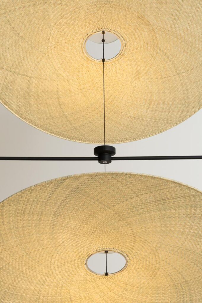 Side view of Cilia Pendant highlighting organic palma texture and metal accents
