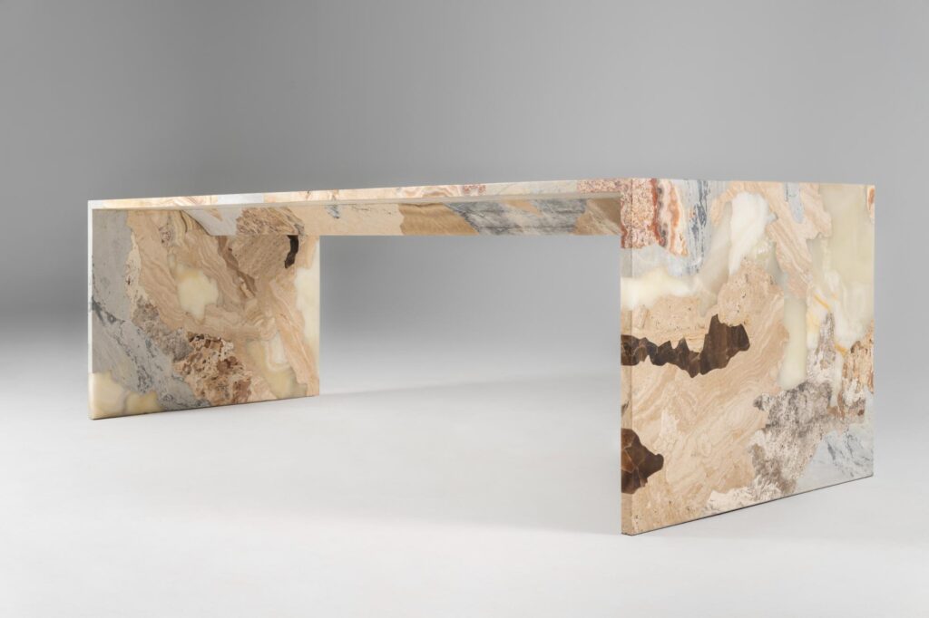 Side view of a Mapa de Suelos table showing precise stone layering inspired by Peru’s geological strata