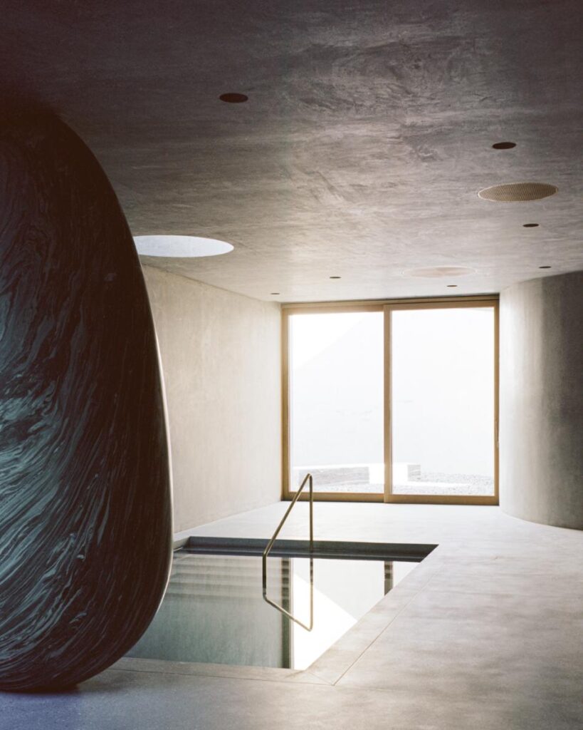 Subterranean bathing chamber with stone ovoid column inside the lower level of the House of Horns