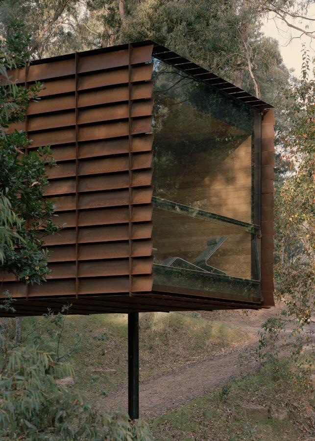 Steel slat facade of Sawmill Treehouse providing natural cooling and shading in BAL 40 bushfire zone