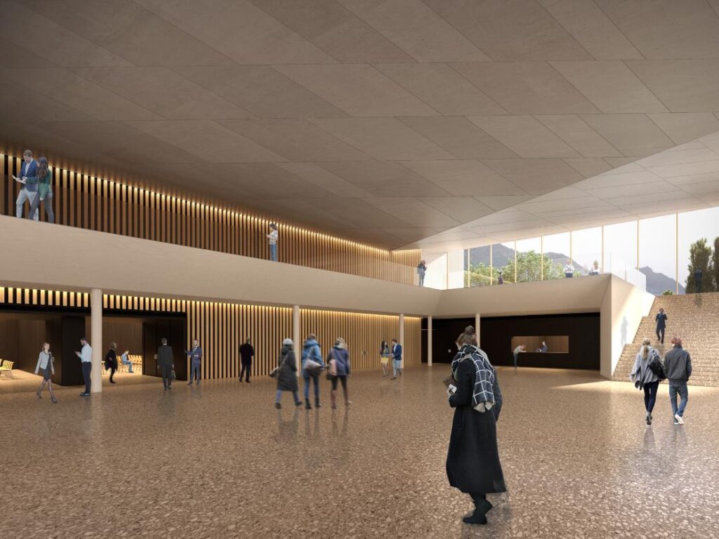 Interior of the scenic two-level foyer in the Conference Centre with expansive glass walls overlooking Lake Garda