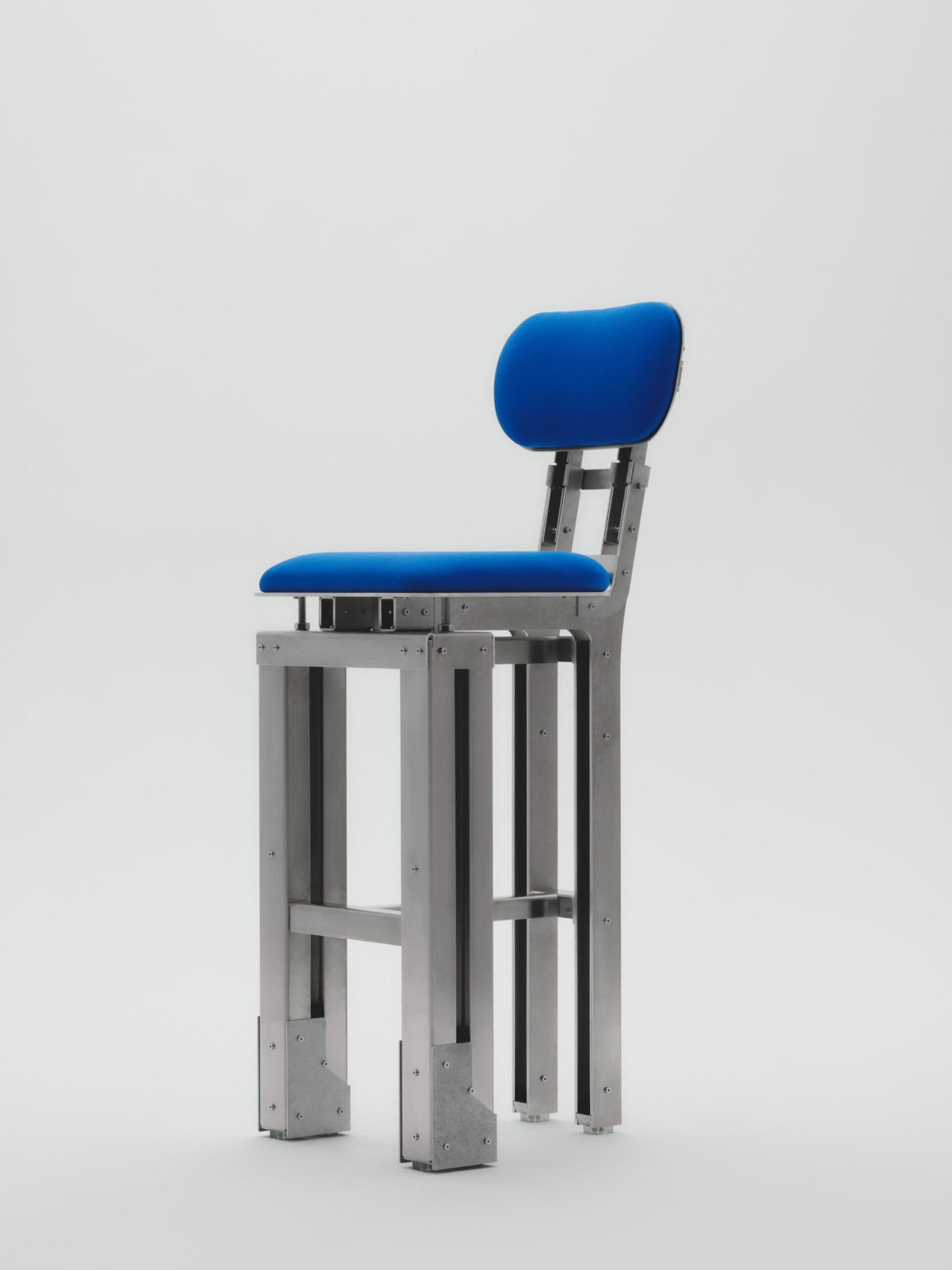 Modern ergonomic chair with a blue cushioned seat and backrest on a sleek metallic frame.