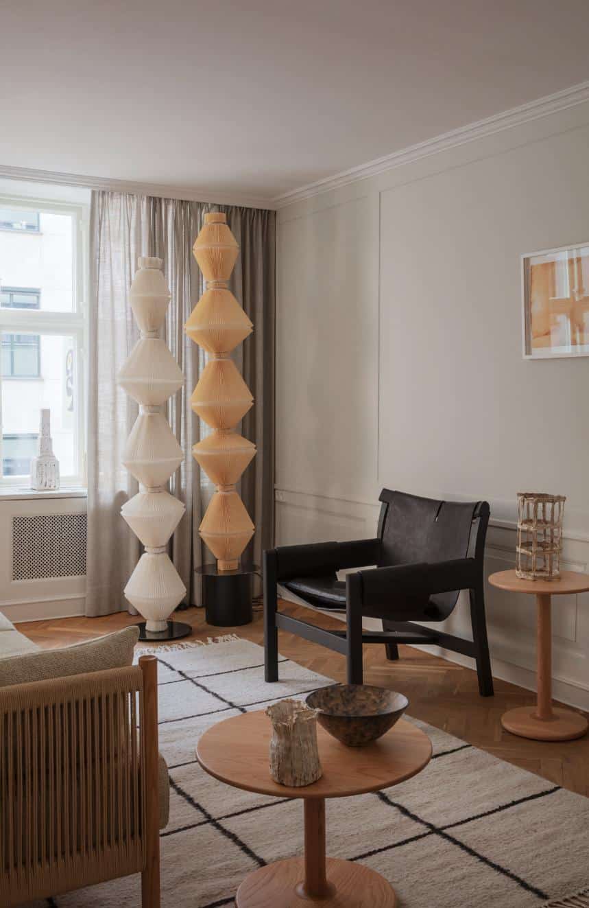 Elegant modern interior with stylish lighting, cozy seating, and minimalist decor for contemporary home design.