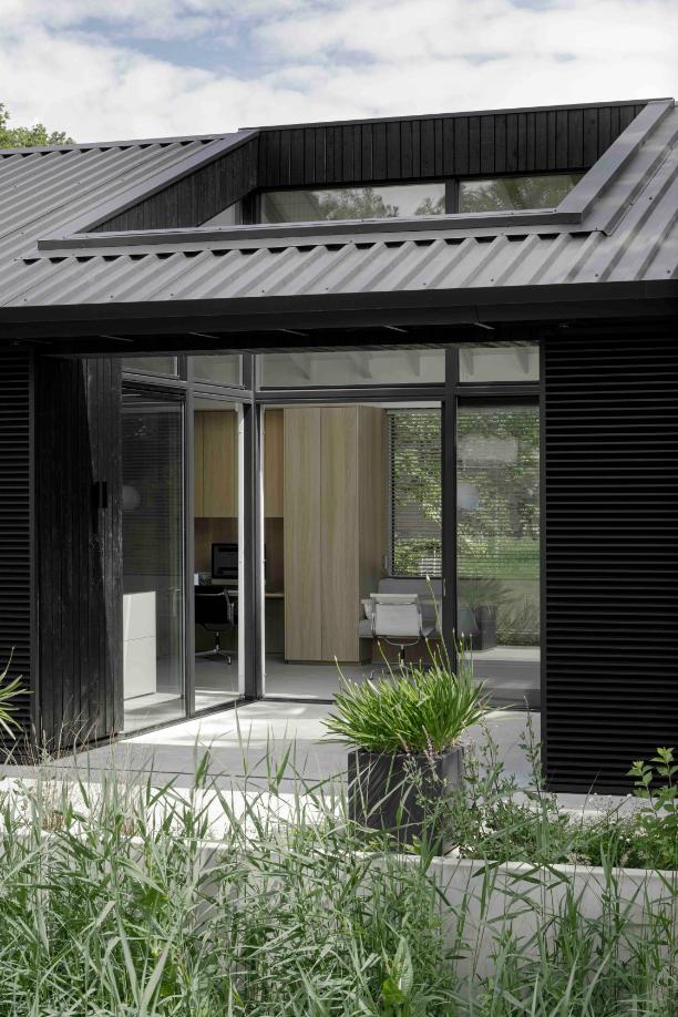 Sliding glass doors creating indoor outdoor flow in compact senior residence