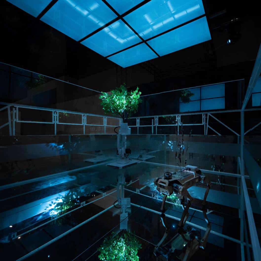 Robotic plant growth system with LED lighting in high-tech laboratory setting.