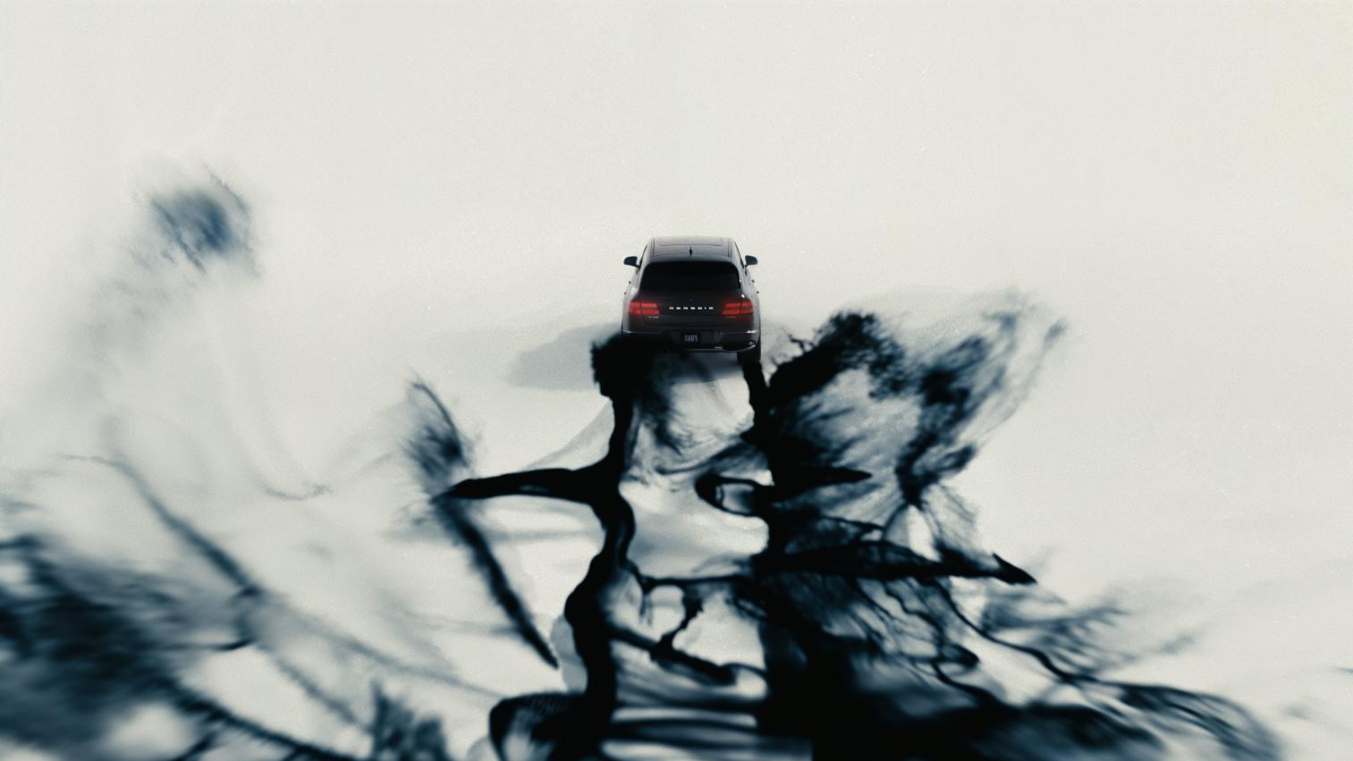 Futuristic black car driving through snow with abstract shadowy tree reflections on icy surface.