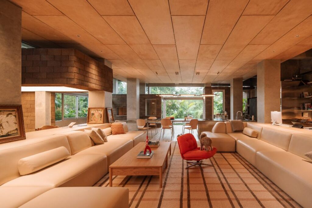 Open-plan living area with natural light and minimal furnishings