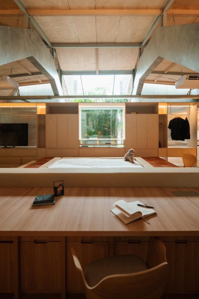 Intimate reading nook framed by geometric window views