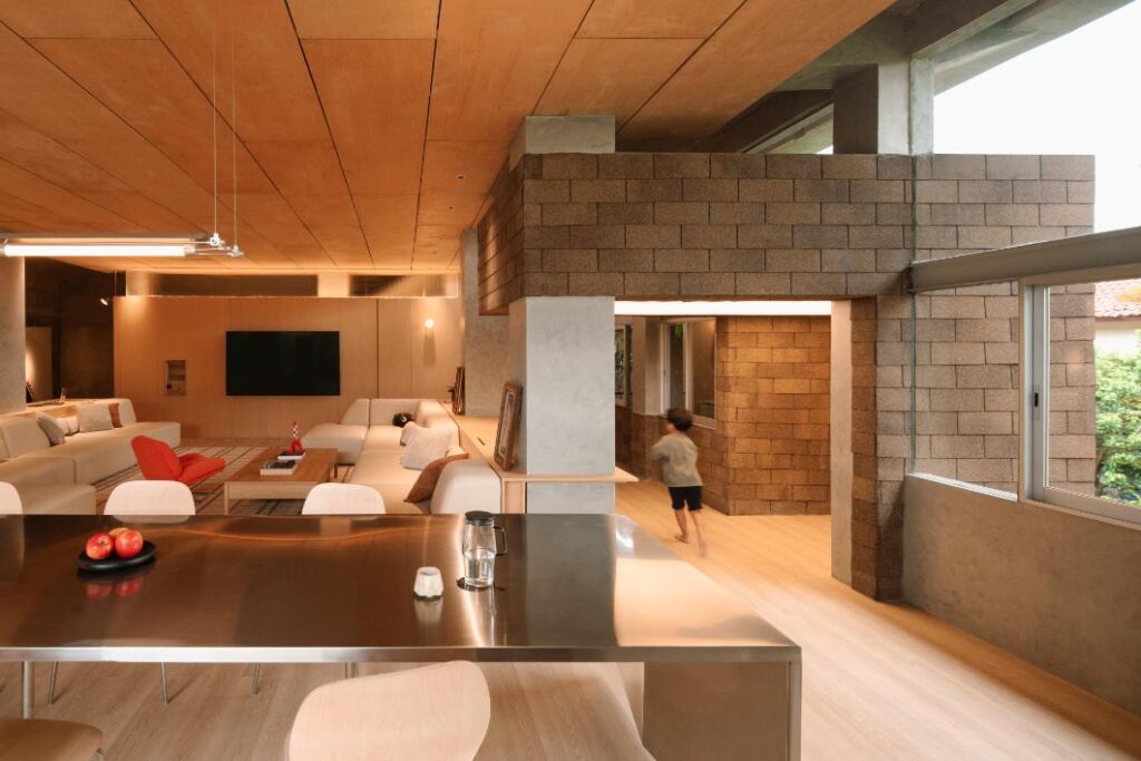 Stainless steel pantry contrasting with wood textures

