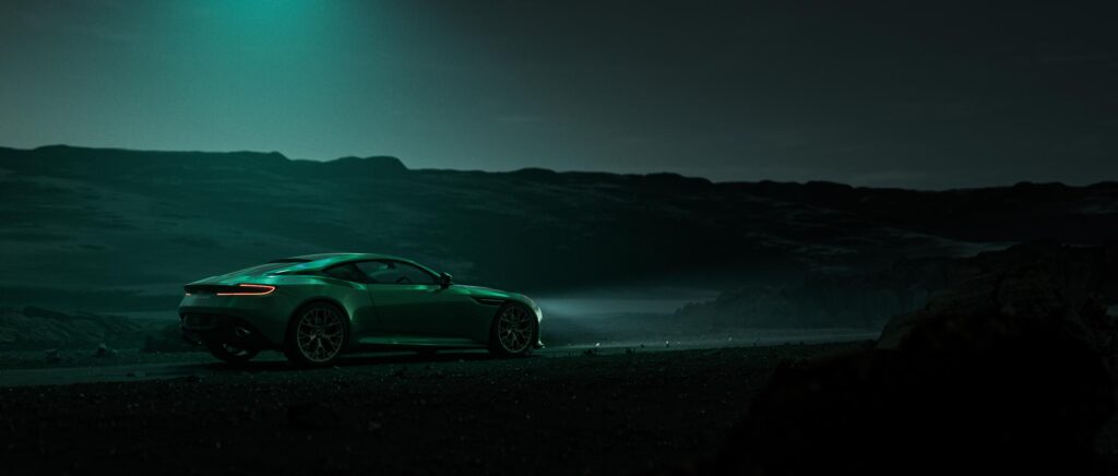 Cinematic still of Aurora film showing Aston Martin in cold northern terrain