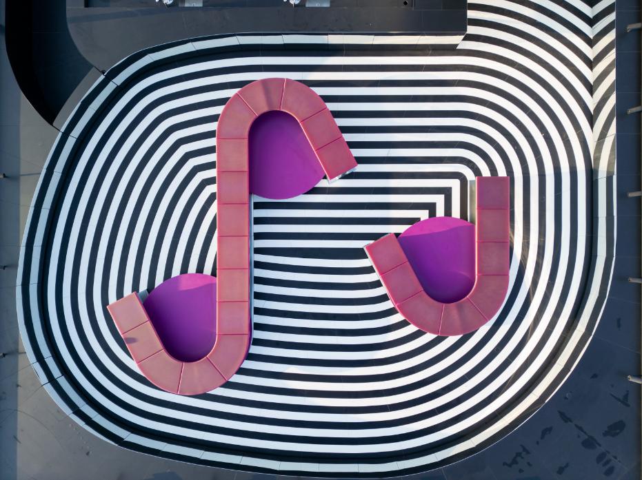 Carbon fiber outdoor furniture with chrome finish and LED lighting at Fondazione Prada Tower