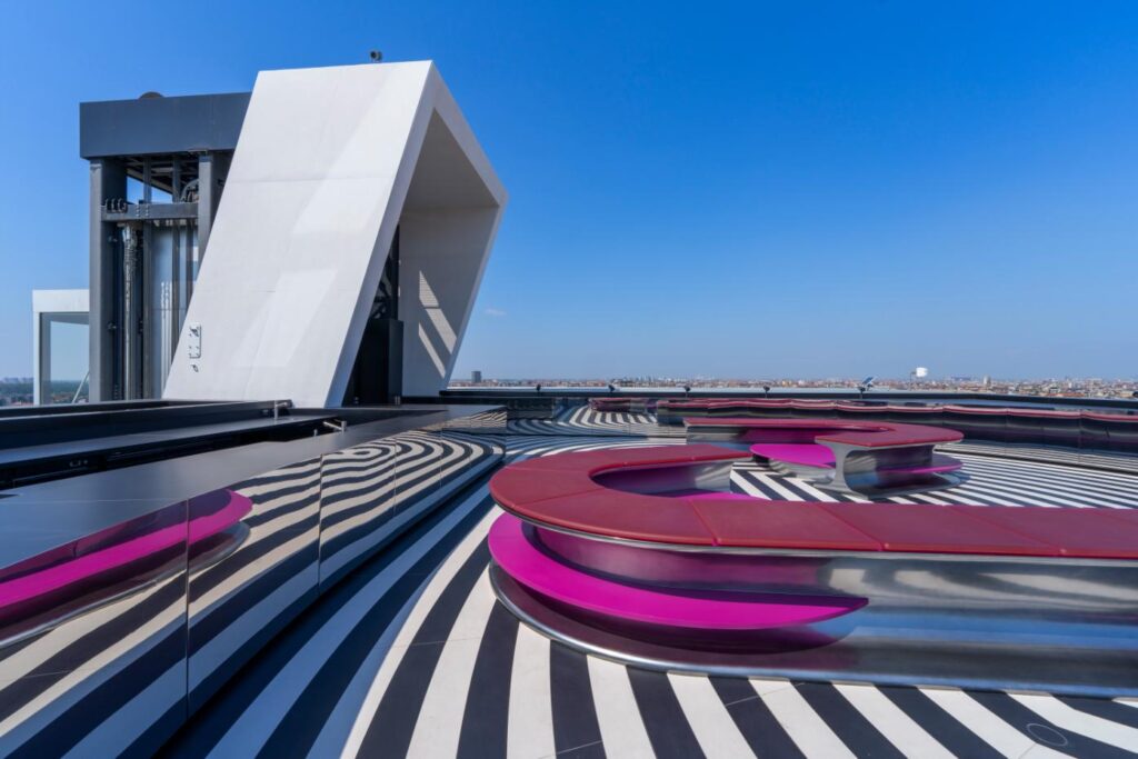 Modern modular seating with translucent silicone cushions for rooftop event space in Milan