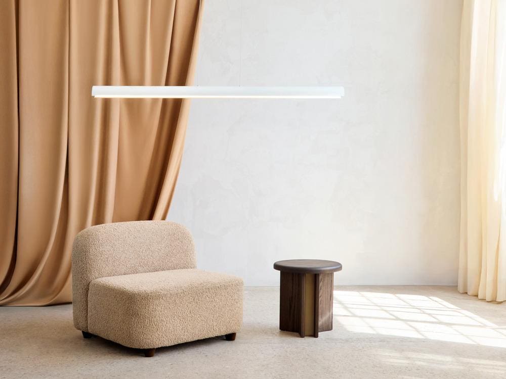 Single Pola pendant in matte white suspended above a modern room