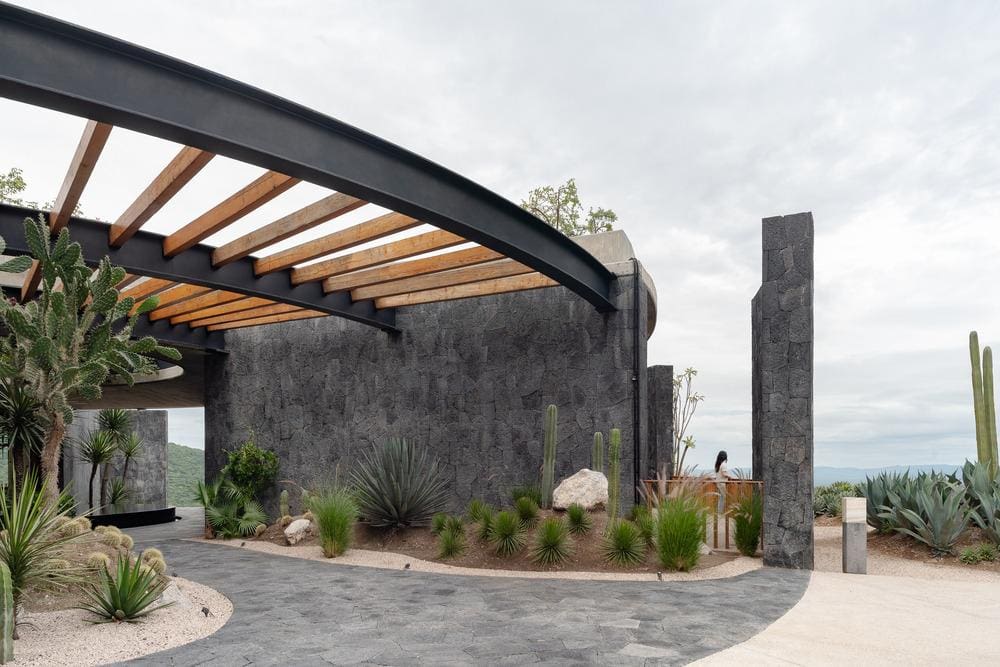 Use of local stone and tepetate integrating with semi desert vegetation