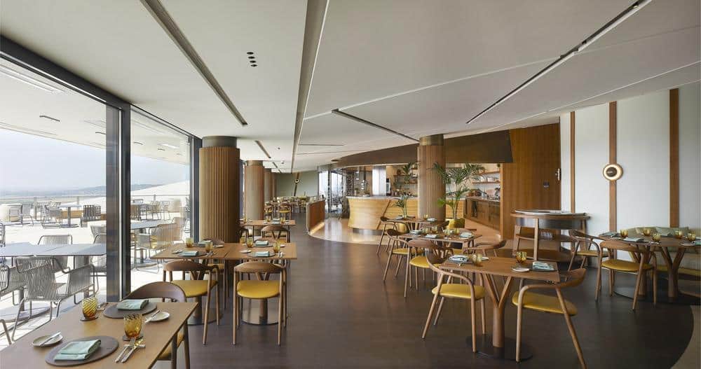 Restaurant interior at Sauska Tokaj winery featuring curved ceilings and natural wood finishes