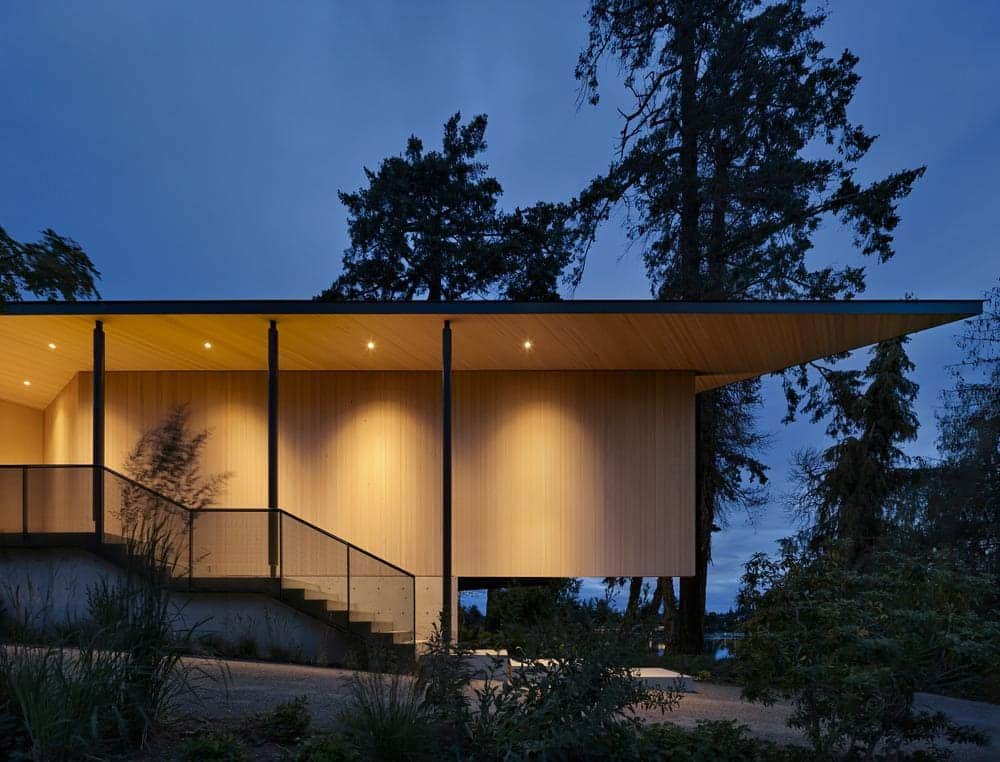 Light-stained cedar cladding contrasting with darker original structure