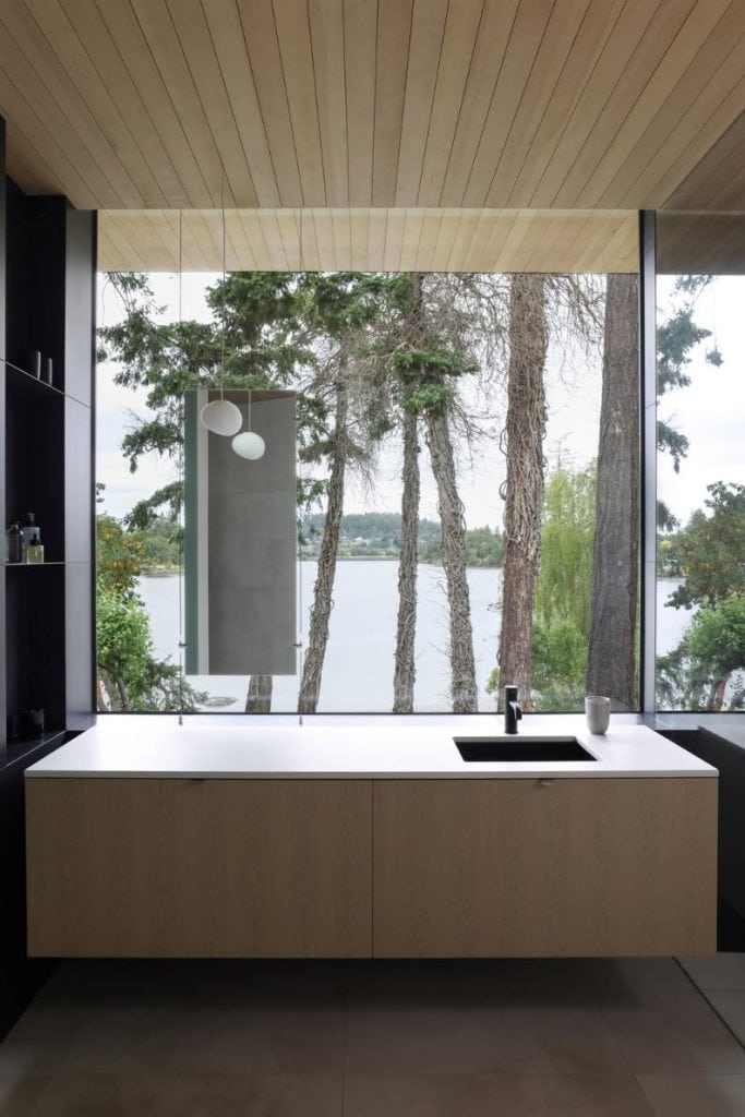 The primary ensuite frames spectacular lake views