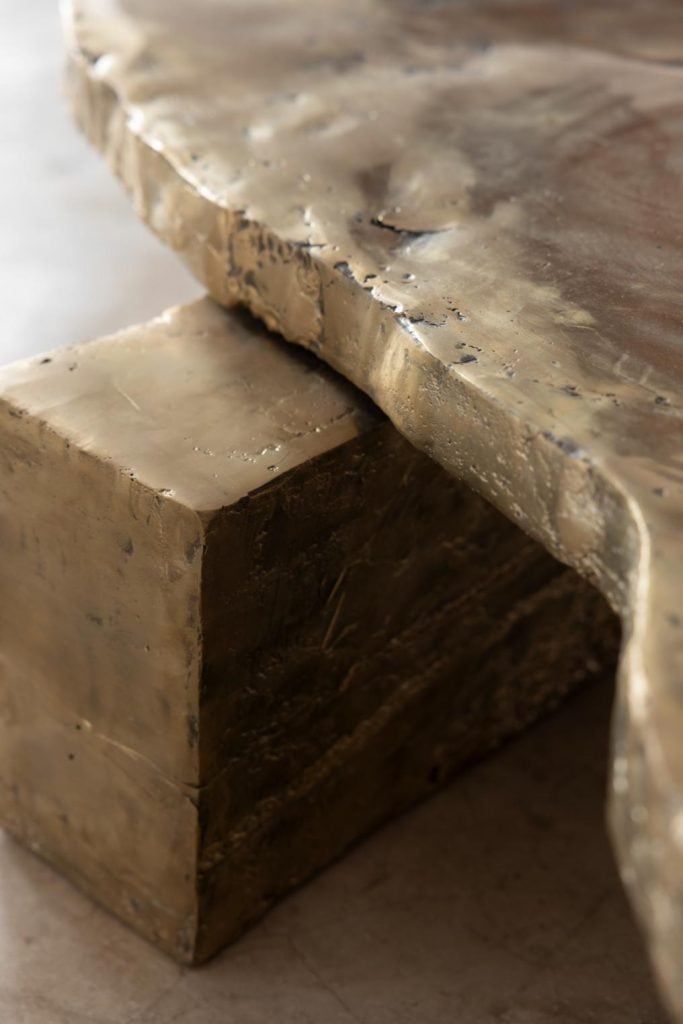 Close detail of wax cast texture on dark metal surface