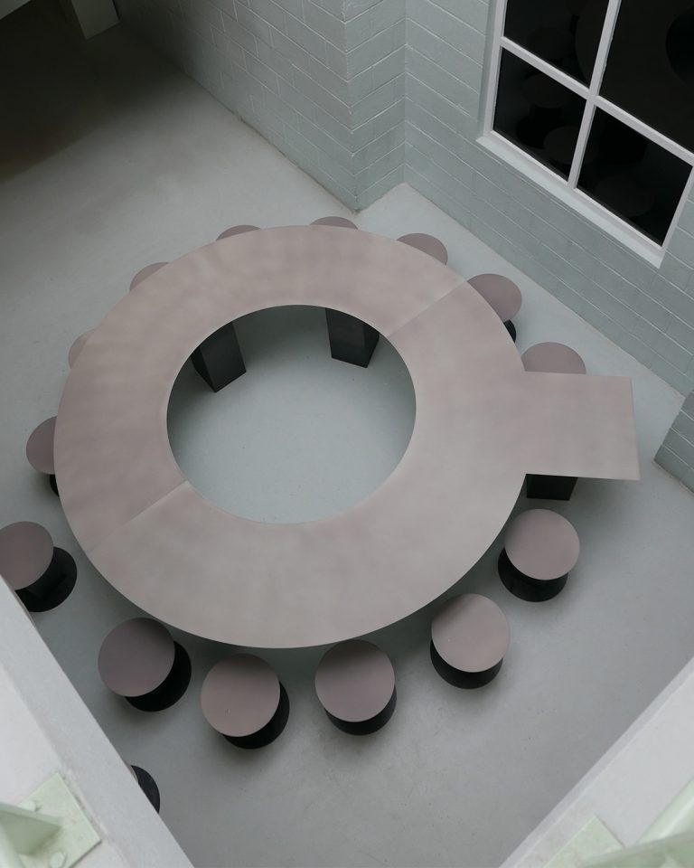 Tom Ducarouge designs Bespoke Table for On Running Steel dining table with heat reactive coating and stools by Tom Ducarouge