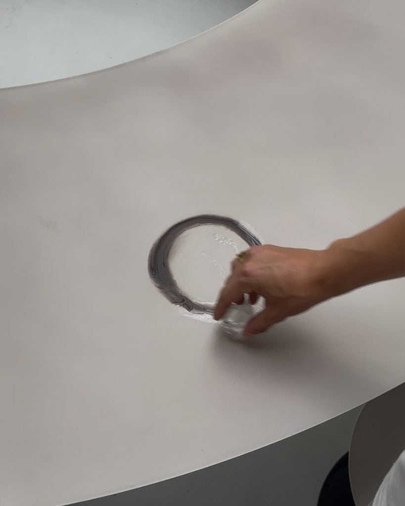Detail of tabletop surface shifting color from heat exposure