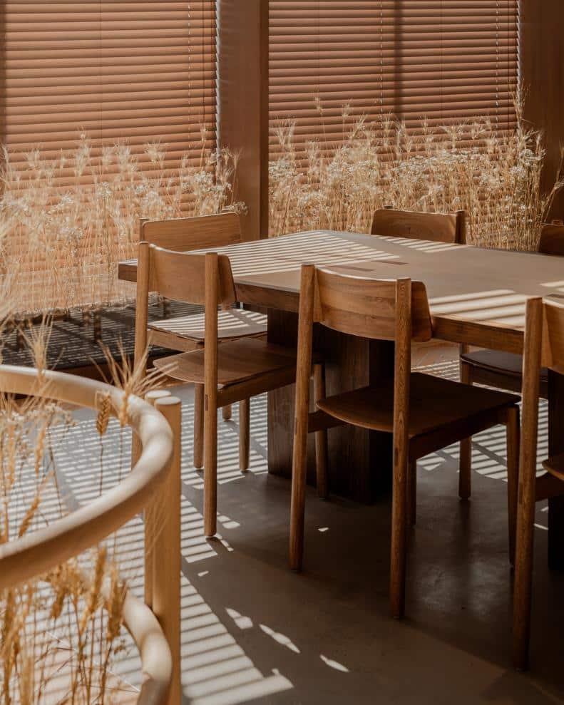 Minimalist chairs and service pieces showcasing kiln-dried reclaimed wood