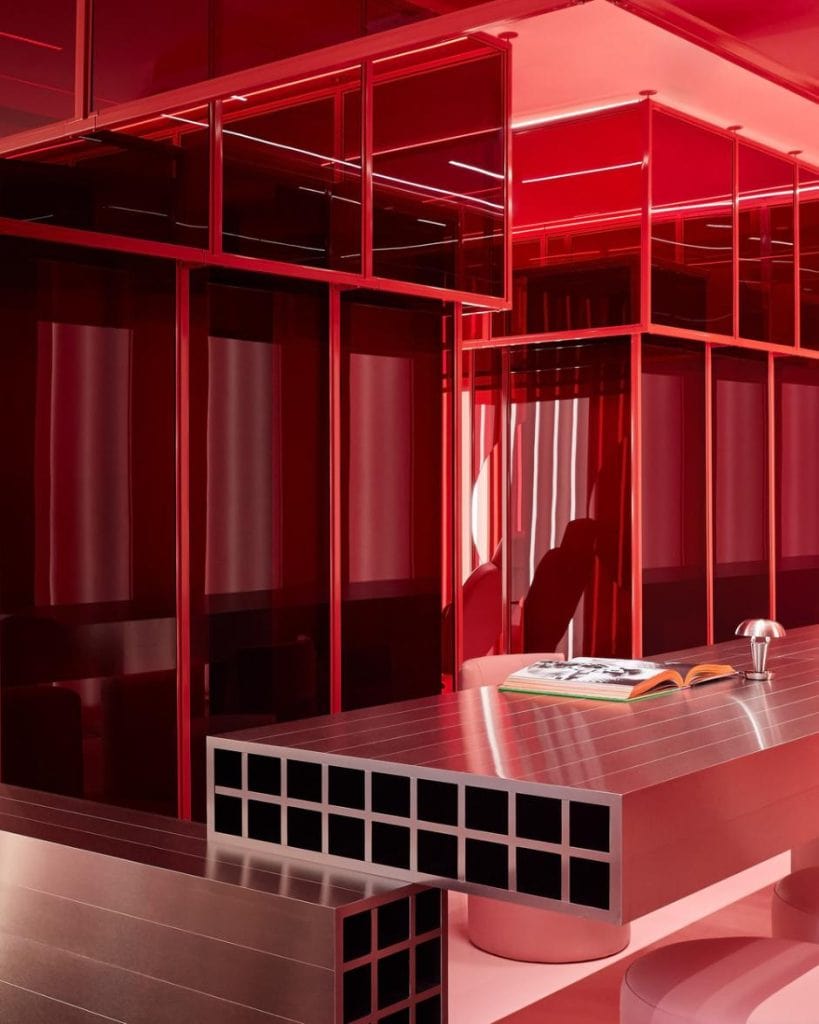 red acrylic walls floating above floor and ceiling create layered transparency