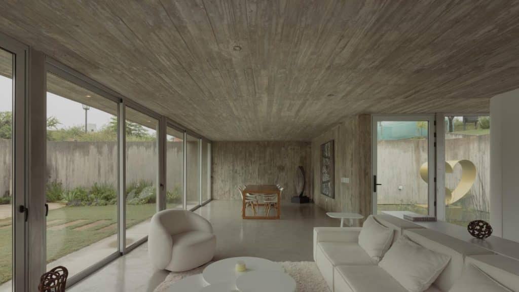 Interior living area flowing toward the sheltered courtyard patio