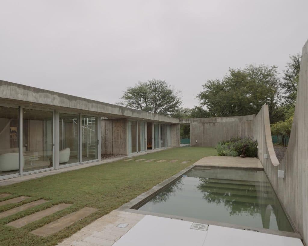 Central courtyard with pool framed by surrounding living spaces