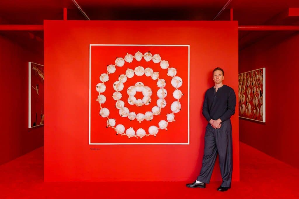 Brad Walls in front of his work