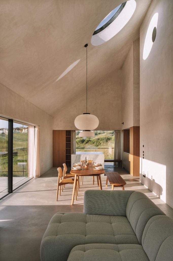 Interior living area with double height ceiling and skylight