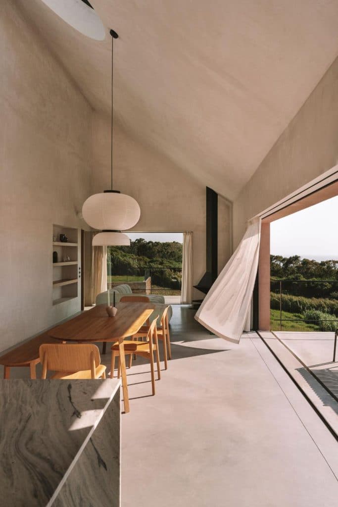 Circular openings filtering sunlight inside Casa Plaj