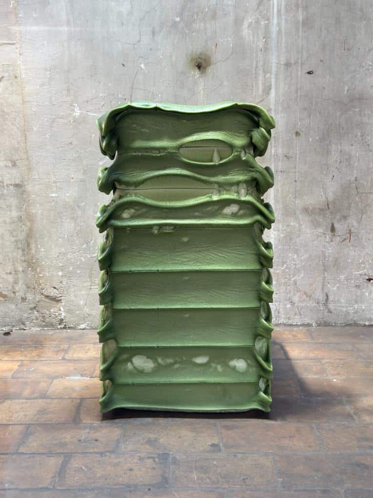 Detail of the chair’s surface with visible strata resembling geological textures