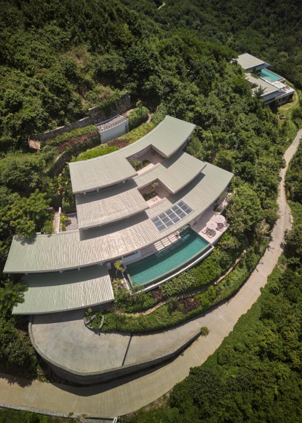 Circular yoga pavilion overlooking hills and ocean