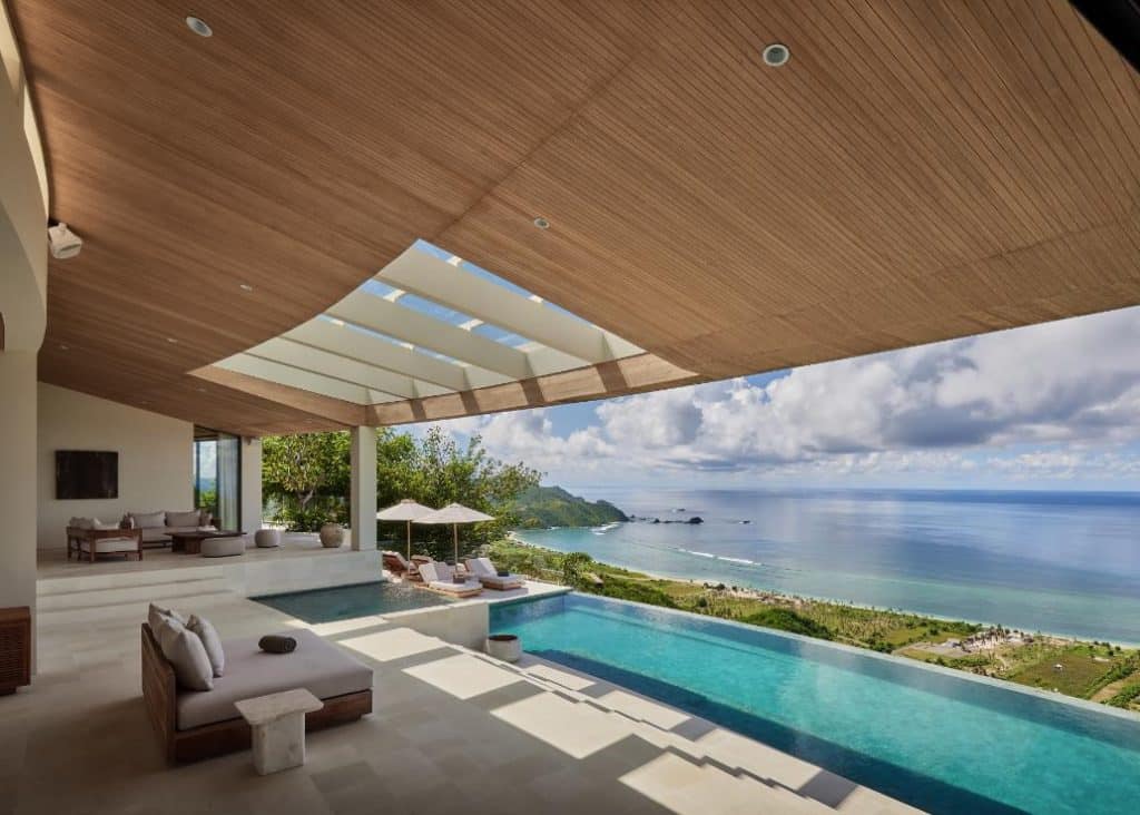 Infinity pool extending from living areas into landscape