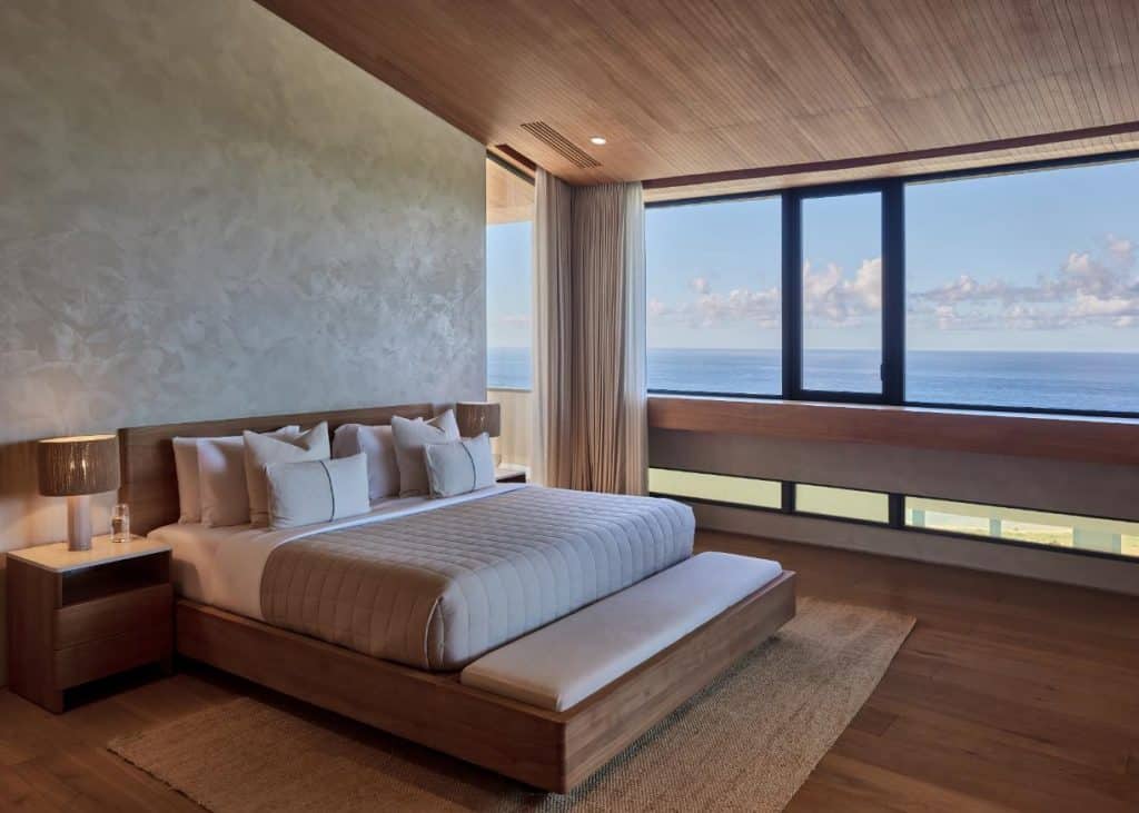 Private bedroom wing framed by hillside vegetation