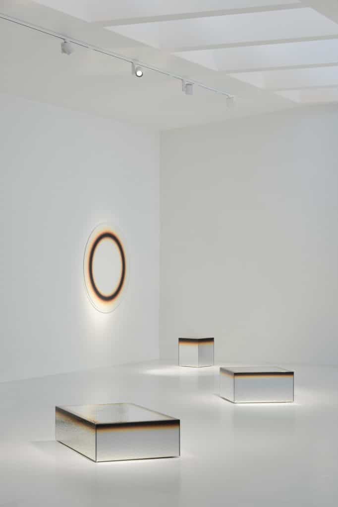 Sculptural table from the Ilior series with reflective geometry